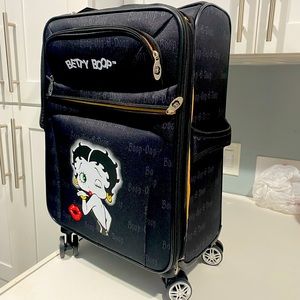 Betty Boop Luggage with spinner wheels is also a carry on. NWT
